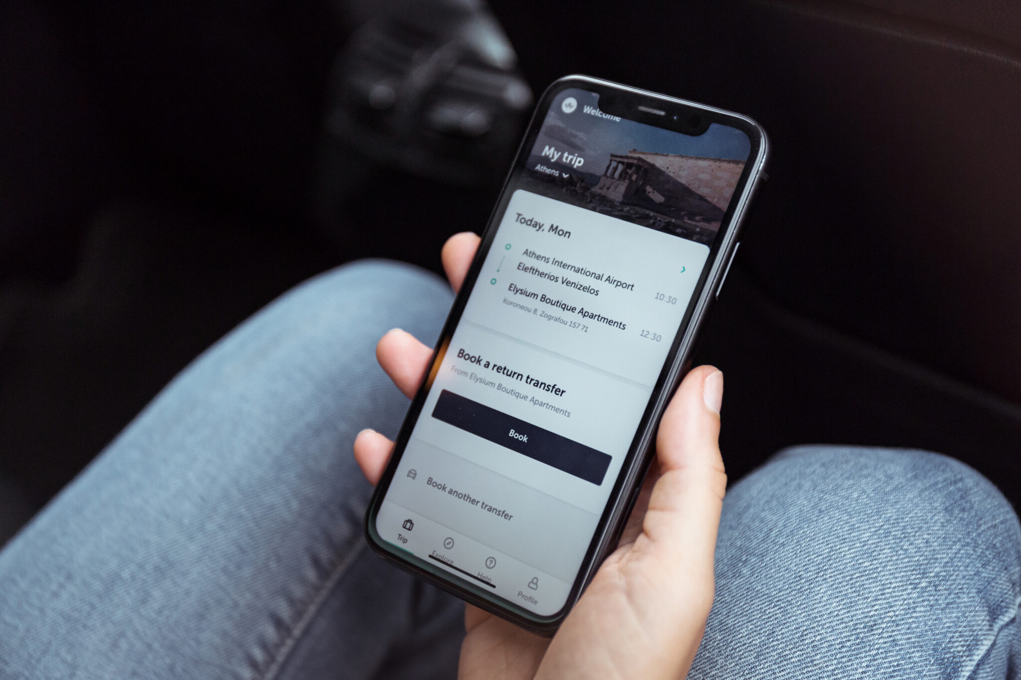 Driver using the Welcome app on a smartphone