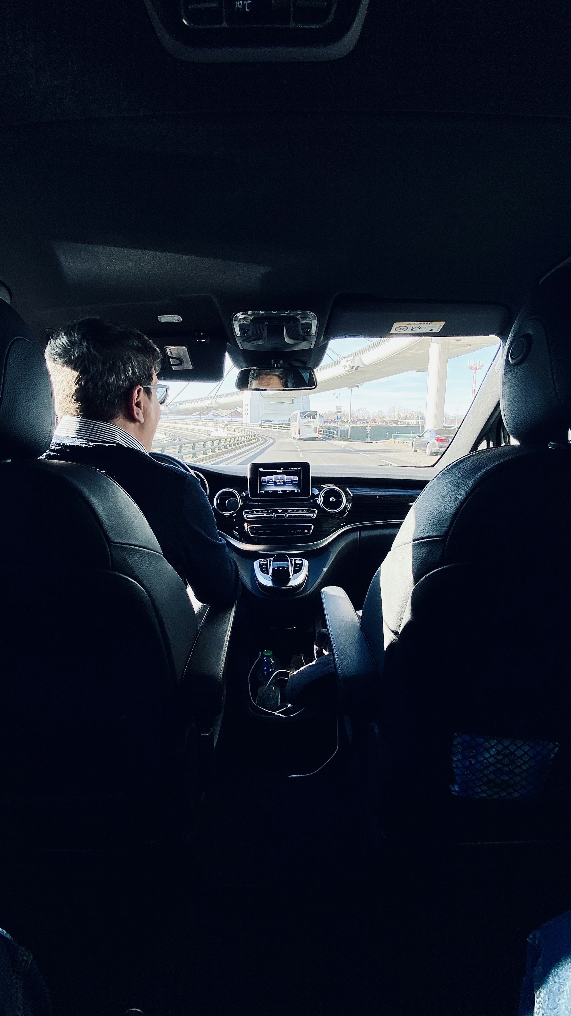 Professional male driver in a Mercedes car